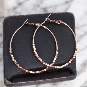 Minimalist medium sized rose gold plated hoop earrings. New.